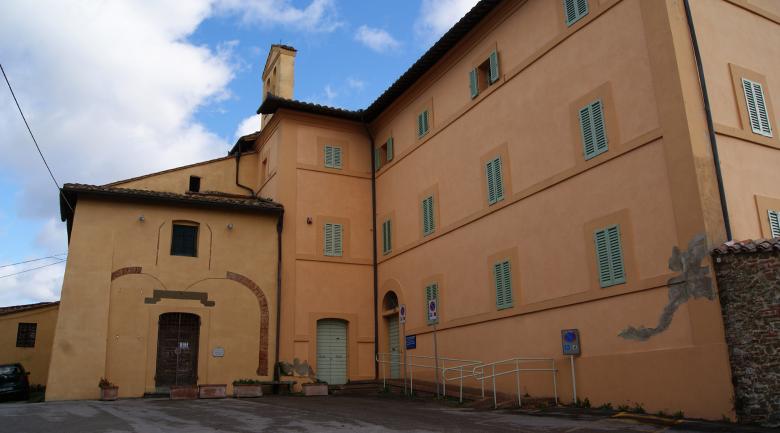  Panoramic view of the exterior of the Church of San Sebastiano, with its simple plastered façade, reflecting a modest and restrained architecture. 