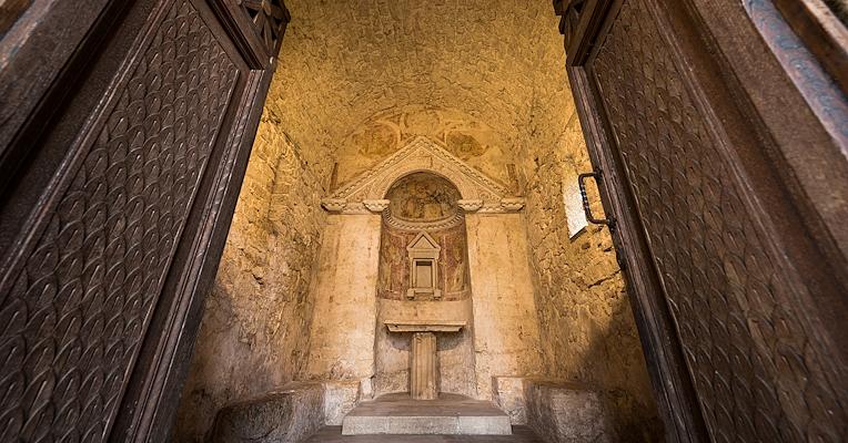 Interior view of the Temple of Clitunno, with apse and niche containing the tabernacle, showing traces of frescoes