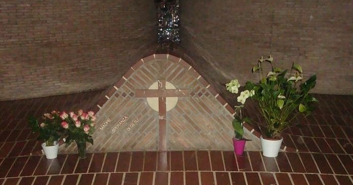 Tomb with a brick cross and the inscription 
