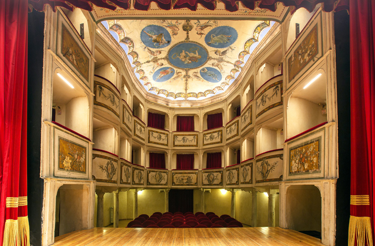 Titolo: Interior of the Teatro della Concordia in Monte Castello di Vibio, with painted boxes, red curtain and decorated ceiling. 