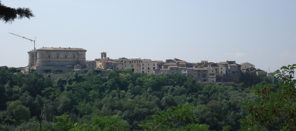 Panorama of the Rocca of Alviano and the medieval village, lying on a green hill surrounded by Umbrian woods