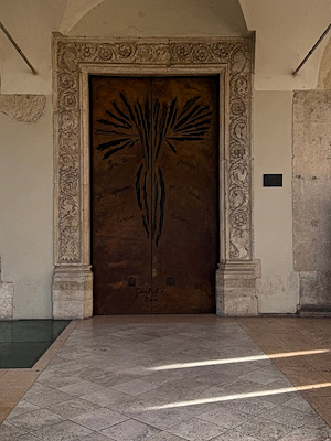 Portal of the Cathedral of Santa Maria Assunta in Terni, carved in stone with vegetal and animal motifs