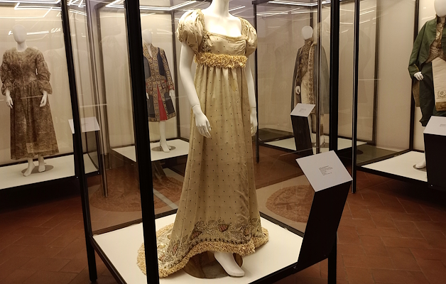 Alexandrine Bonaparte’s dress, white with black polka dots, featuring a wide neckline and a train