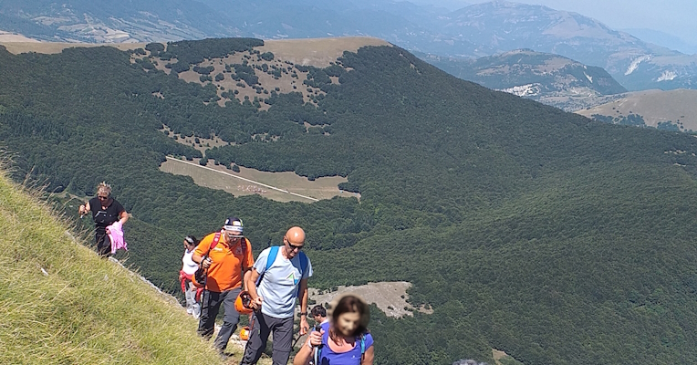  Hikers walking on Monte Cucco 