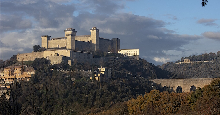 The Rocca Albornoziana in Spoleto with the Ponte delle Torri, surrounded by the landscape