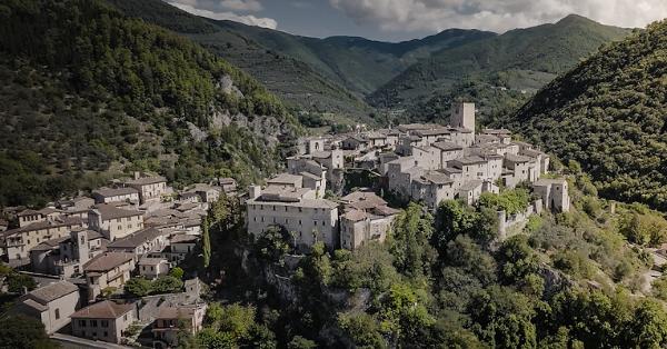  View of Arrone, a medieval village perched on a hill surrounded by mountains. 