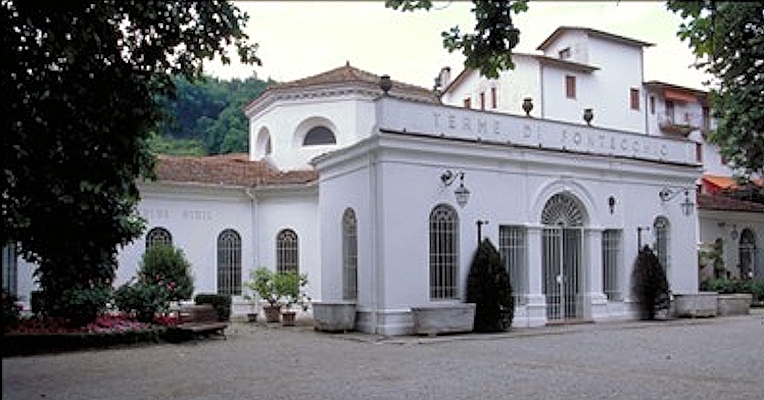 Facade and entrance of the Fontecchio Thermal Baths, a spa facility built in the late 19th century.