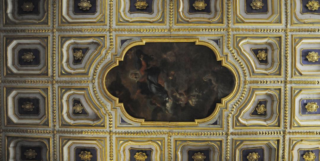 Detail of the gilded coffered ceiling with central fresco in the Collegiata di Santa Maria Assunta e San Gregorio.