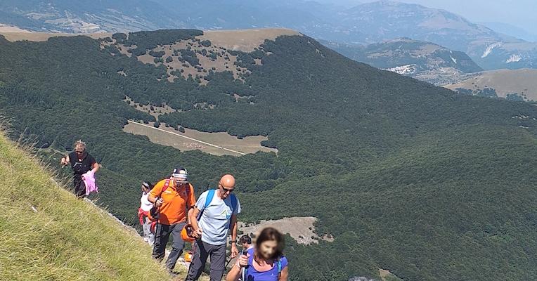 Hikers walking on Monte Cucco