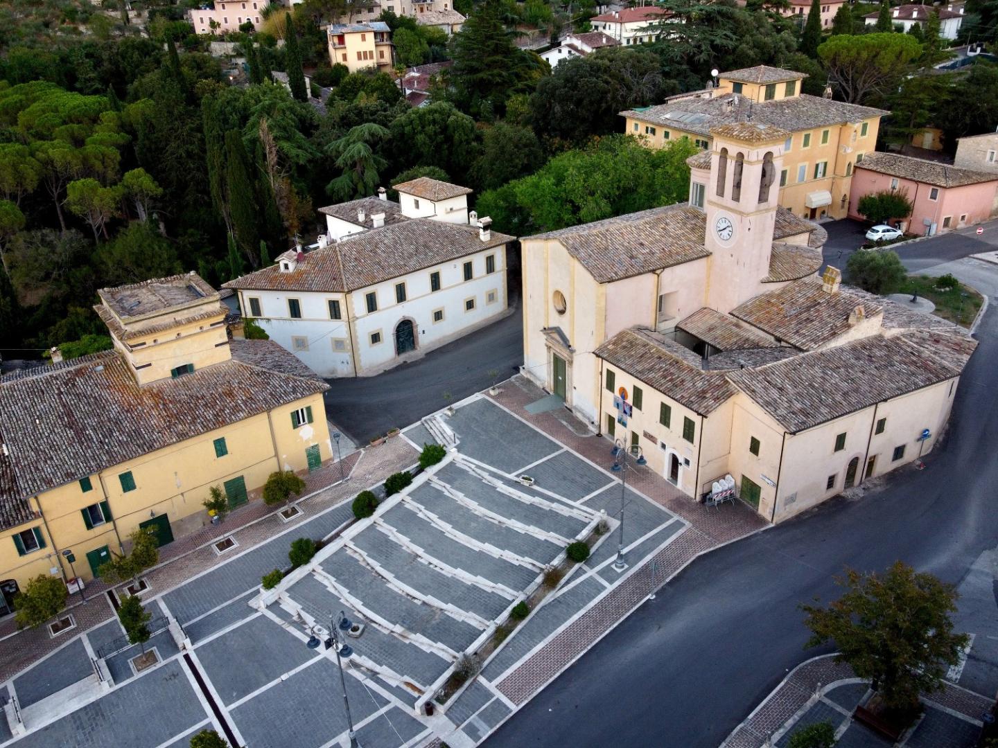 Aerial view of the square and the Church of Madonna della Bianca surrounded by historic buildings